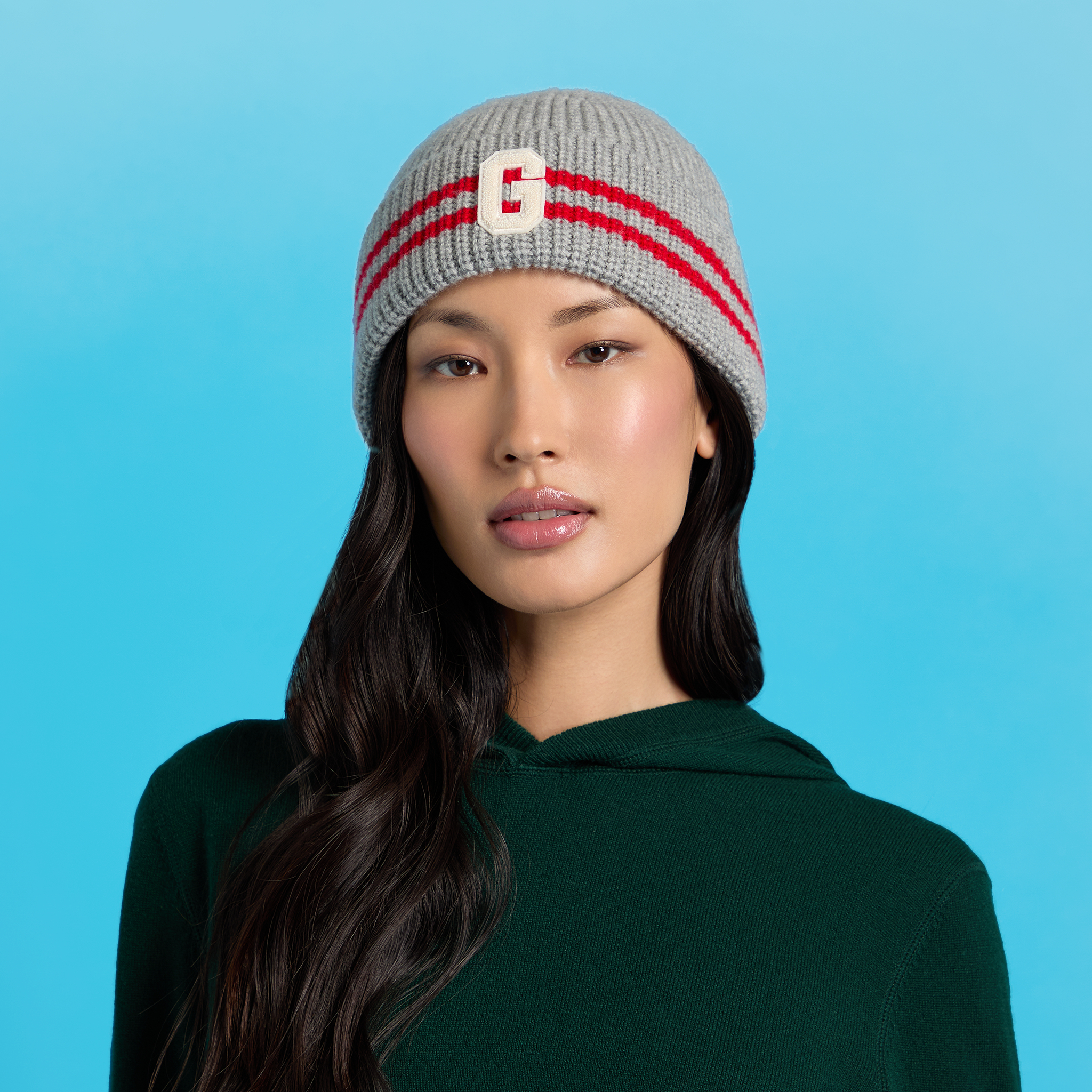 G/FORE Kids Striped Beanie in Blue and Black Black beanie hat with blue and grey stripes and detachable  main image 2